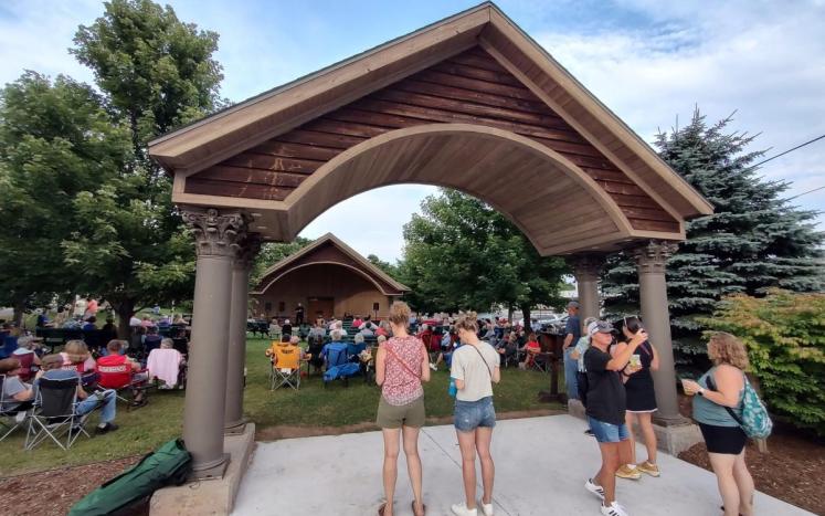 A gathering of people at the Breitung Park Band Shell